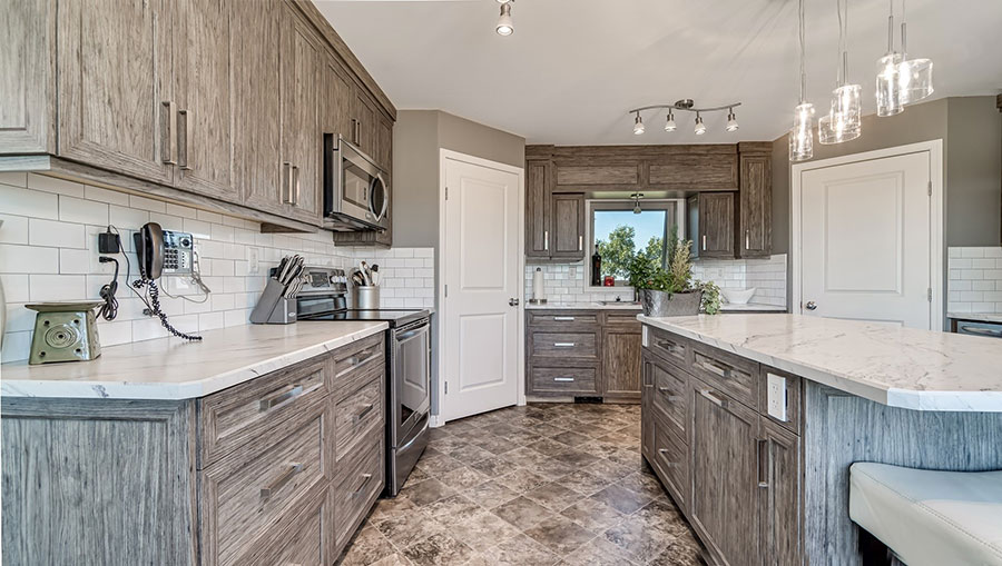 https://www.hanovercabinets.ca/wp-content/uploads/2019/08/thermofoil-cabinets-textured-luxury-vinyl-wrap-moose-jaw-regina.jpg